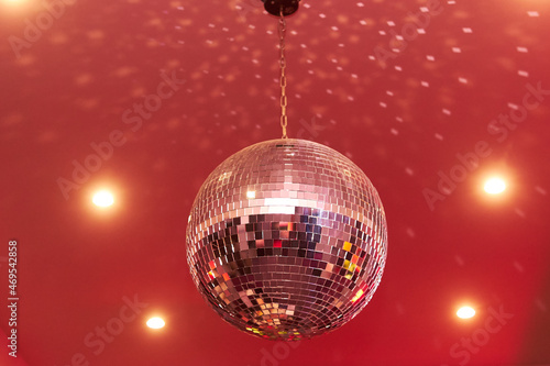 Red disco mirror ball in the club party