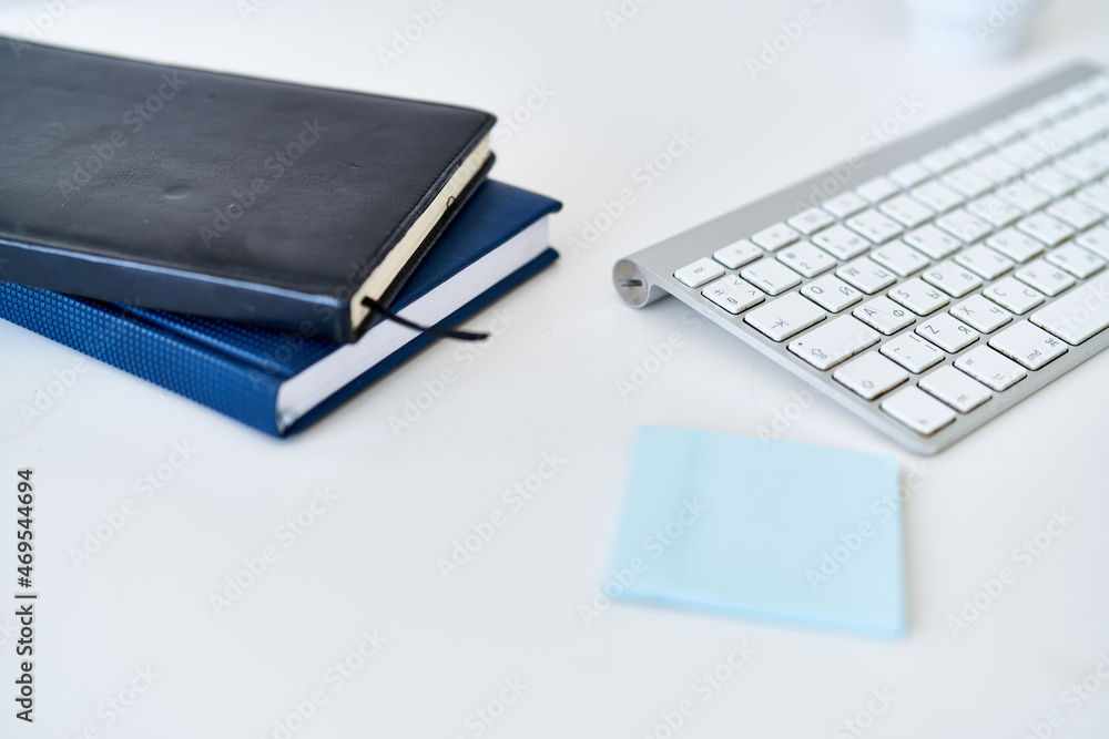 wireless keyboard on desktop cup documents office