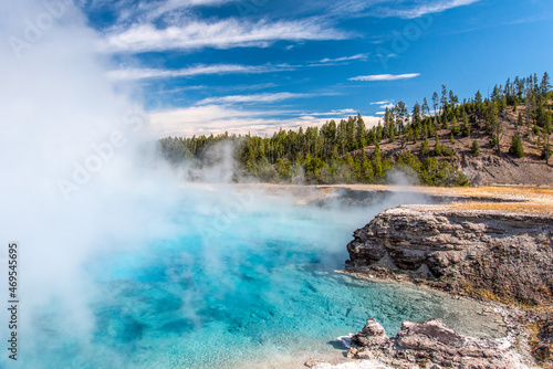 Bright azure colored hot pool in Yellowstone National Park