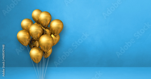 Gold balloons bunch on a blue wall background. Horizontal banner.