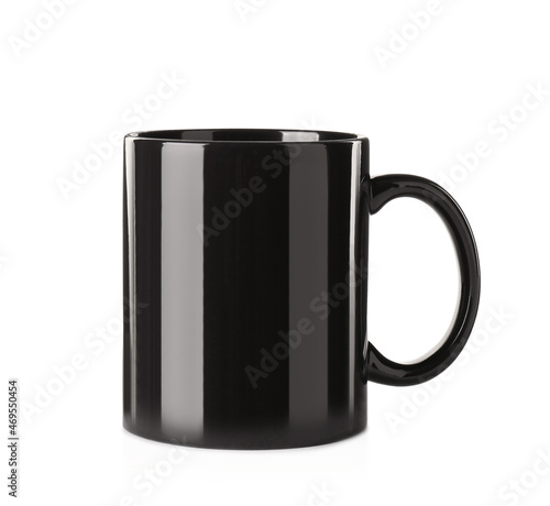Empty black ceramic mug isolated on white