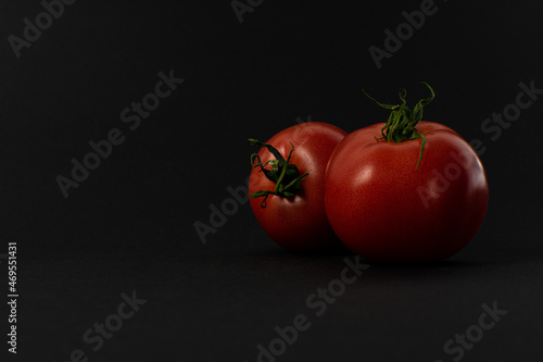 Tomatoes on a black background