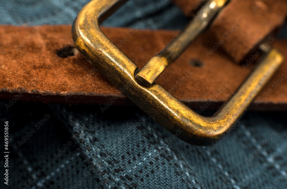 Brown men's trouser belt close-up. Men's clothing accessory Brown men's trouser belt close-up. Men's clothing accessory