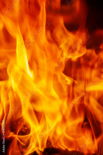 Close up fire flamme background as symbol of hell and eternal pain. Vertical image.