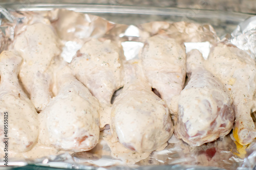 Marinated Raw Chicken Drumsticks on a pan