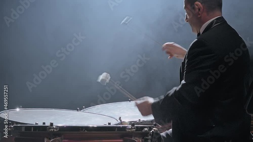 Musician playing the timpani