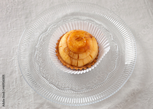 Small custard pastry in a transparent dish.