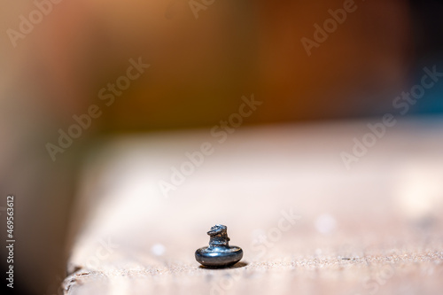 bolt head turned over to show sheared threading after stress failure
