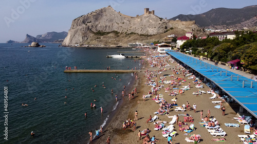 Flight over the embankment and the beach in Sudak.