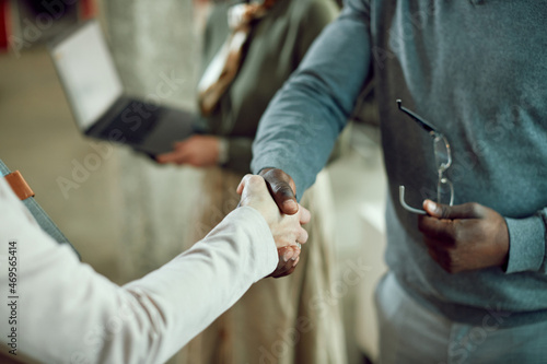 Close-up of business partners shake hands after successful meeting.