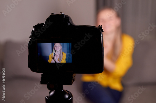 video lesson recording on a professional video camera. woman professional makeup artist broadcasts for beginner photo