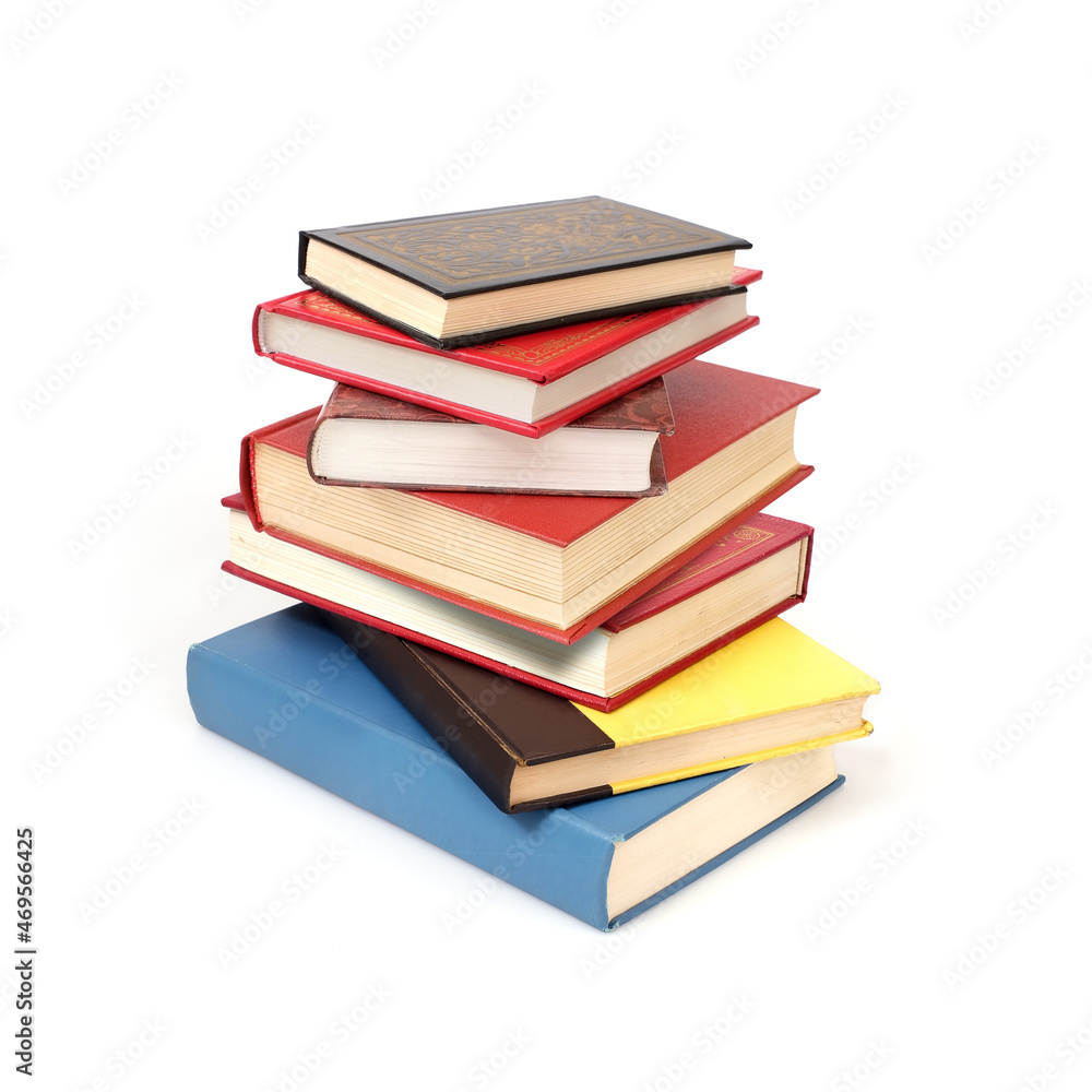 Stack of red, yellow and blue books in colour covers with white sheets isolated on a white background Stack of red, yellow and blue books in colour covers with white sheets isolated on a white background