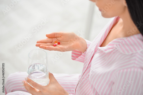 Young pregnant woman taking...