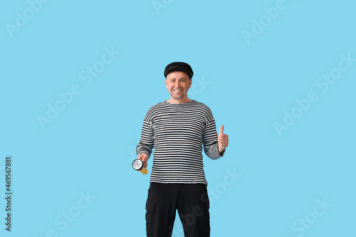 Mature man in sailor shirt ...
