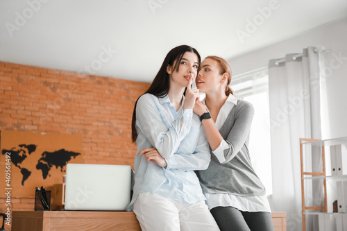 Female colleagues gossiping...