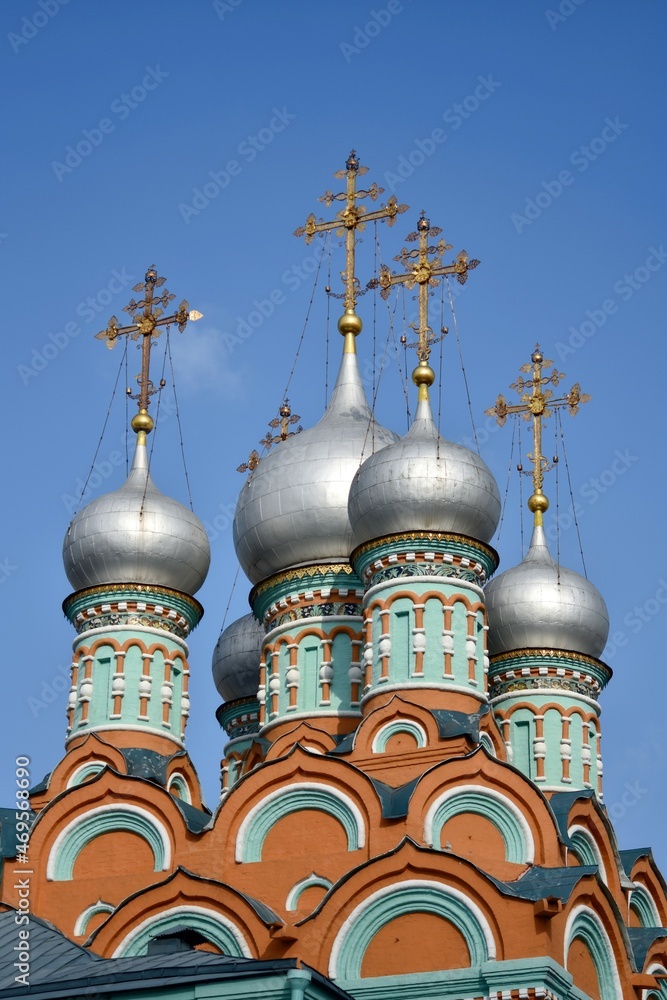domes of an Orthodox church against the blue sky. Moscow Russia Temple of Gregory of Neokesariyskiy
