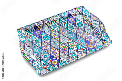 Metal tray with traditional Turkish ornament on a white background.