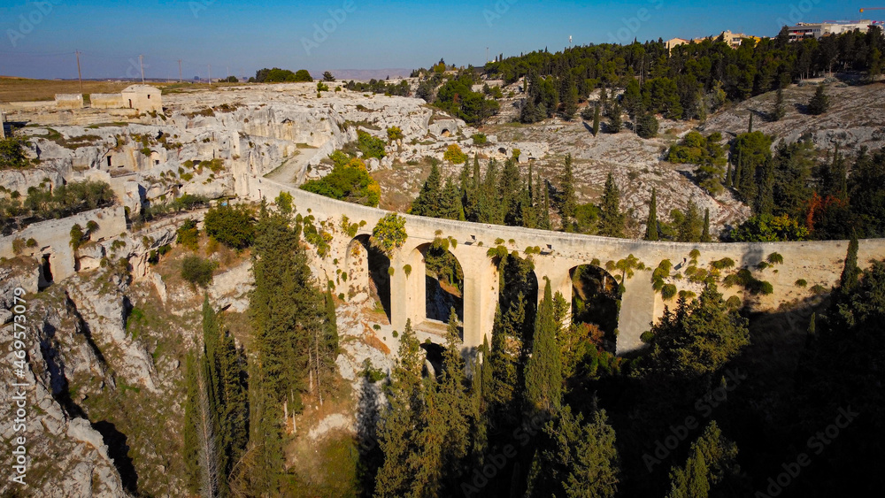 Aerial view over the bridge of Gravina in Puglia in Italy - the ancient aqueduct from above - travel photography