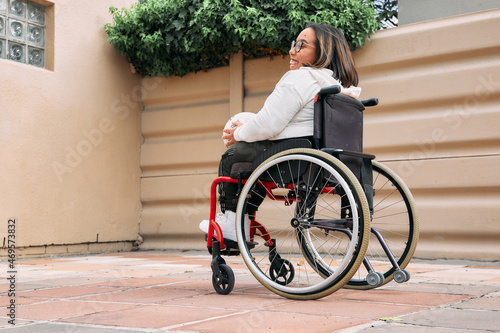 young woman in wheelchair at home