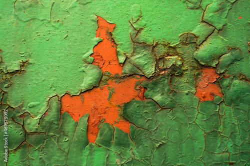 Multicolored background with rough rust texture on metal .