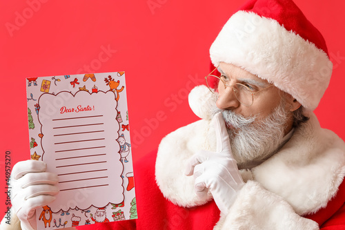 Santa Claus with letter sho...