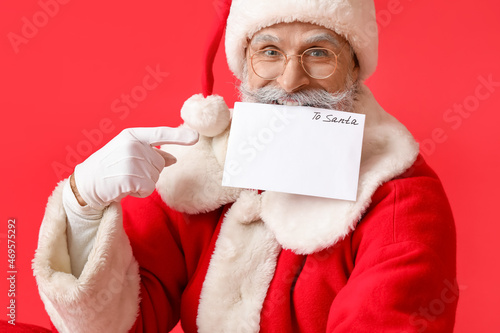 Santa Claus with letter on ...