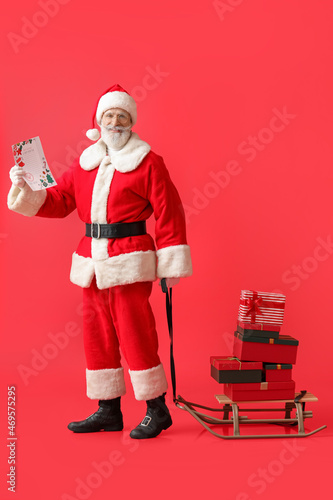 Santa Claus with letter and...