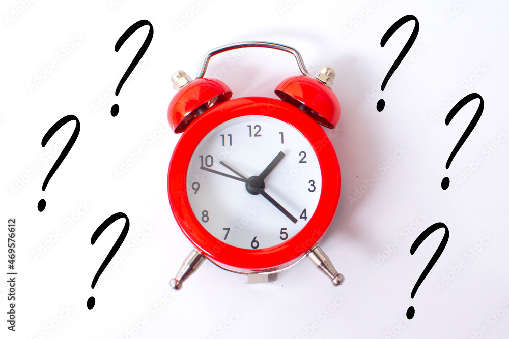red alarm clock and a question mark . FAQ frequency asked questions