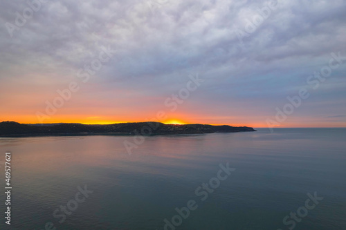 One hundred percent cloud covered sunrise over the sea © Merrillie