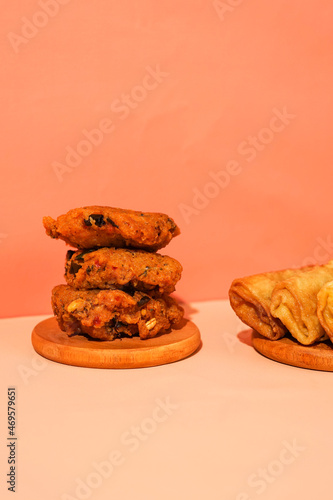 lentho, one of Indonesian street food made from the fried mashed beans. a local food shot for presentation and promotion. the traditional fried food served elegantly. photo