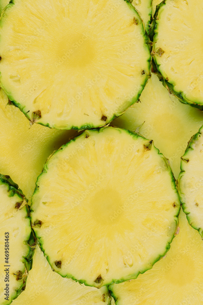 Pineapple juicy yellow slices background. Top view. Pineapple juicy yellow slices background. Top view.