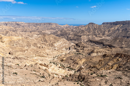 Desert Panorama. Expansive view of Oman's rocky and rolling landscape of gorges and canyons.