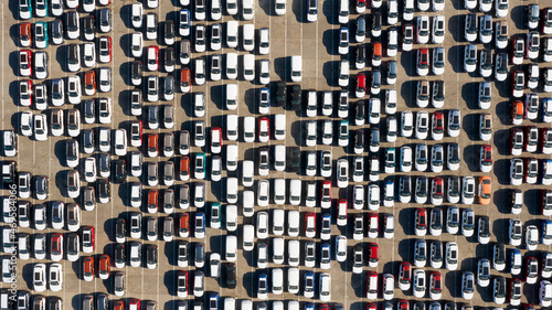 Odessa, Ukraine - August 11, 2021: Aerial view from drone to automobile customs terminal. Large number of cars at customs terminal are awaiting shipment. Accumulative customs platform for cars.