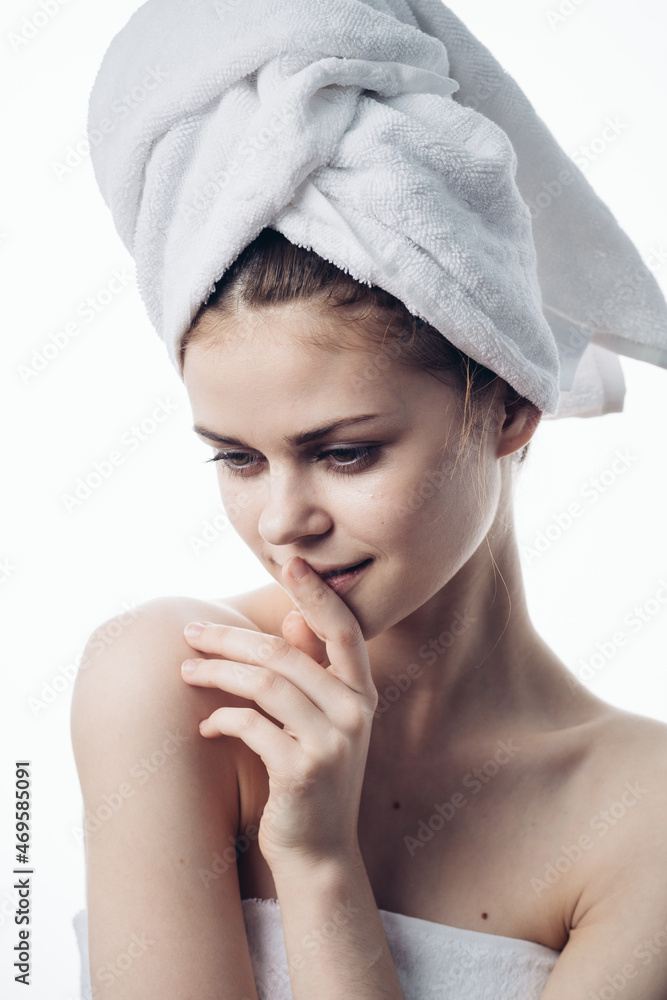 woman after shower with towel on head posing skin care woman after shower with towel on head posing skin care
