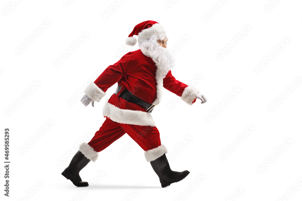 Full length profile shot of santa claus walking fast Full length profile shot of santa claus walking fast