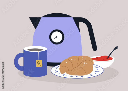 Tea-time set, a kettle, a mug with a teabag brewing in it, a croissant, and a bowl of strawberry jam