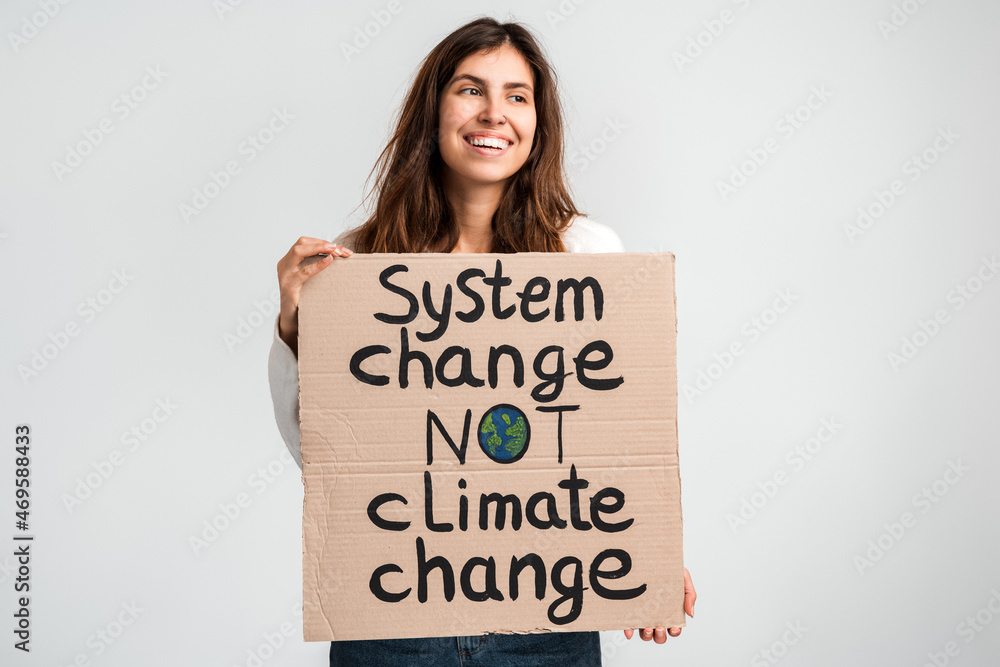 I love planet Earth. Caucasian cheerful woman holding carton placard with signs and looking at it. Concept of nature destruction and eco activism I love planet Earth. Caucasian cheerful woman holding carton placard with signs and looking at it. Concept of nature destruction and eco activism