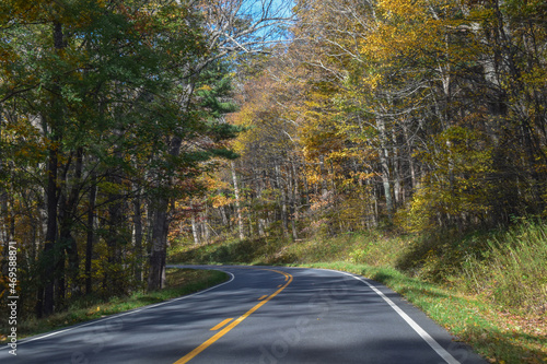 Winding Country Road Traveling Through Beautiful Fall Foliage