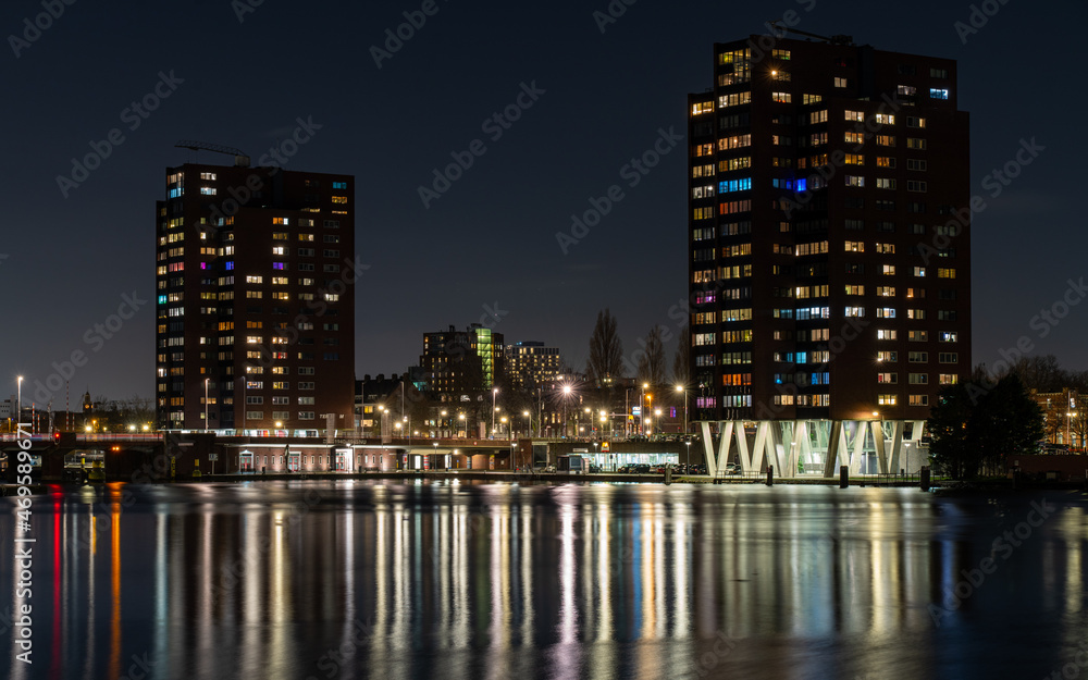 Colourful lights behind windows in Coolhaven Rotterdam, Netherlands