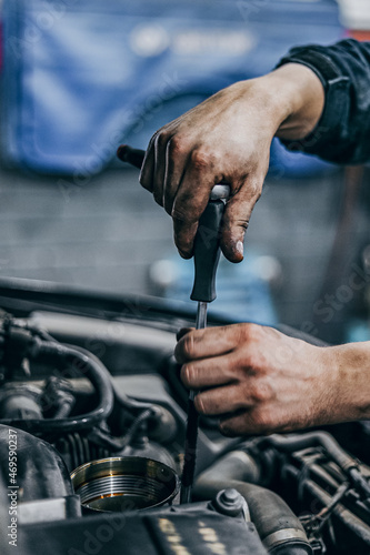 Hands of repairmen toiling in locksmiths workshop