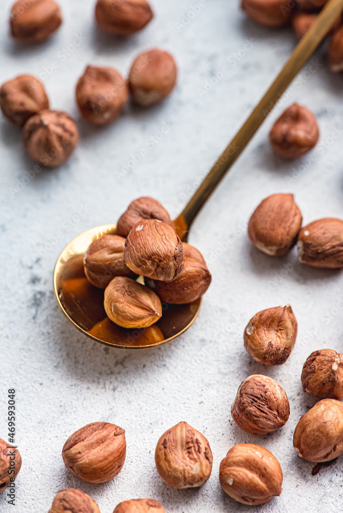Fototapeta premium hazelnuts in spoon
