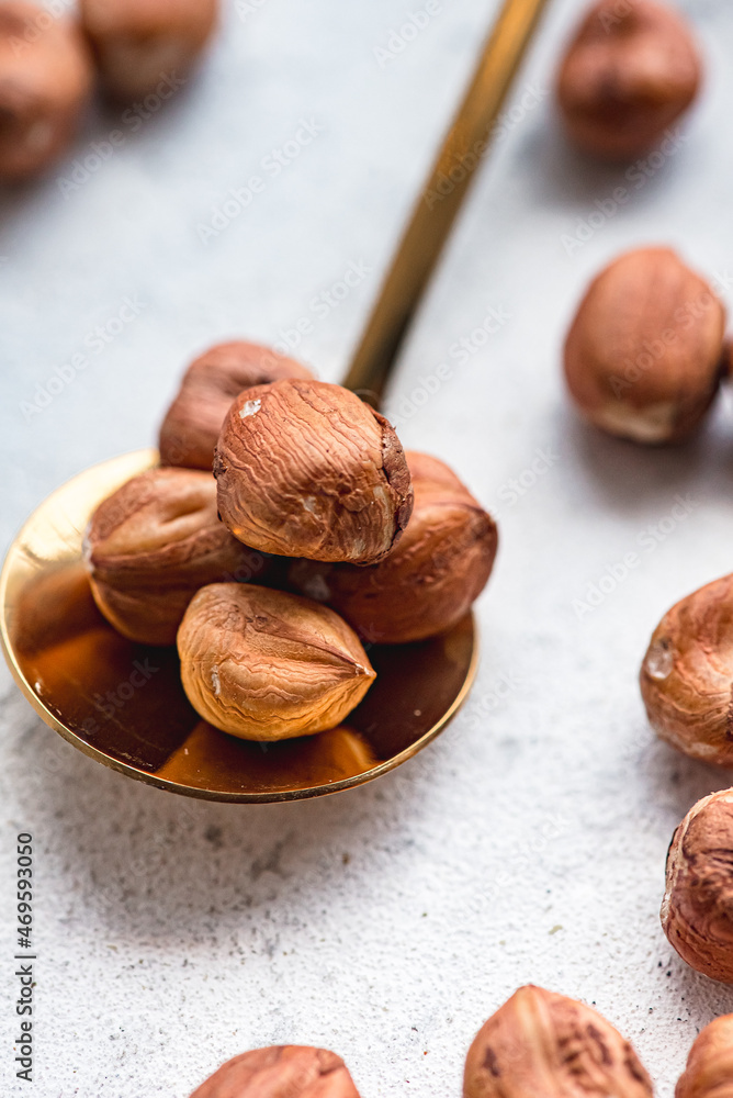 Fototapeta premium hazelnuts in spoon