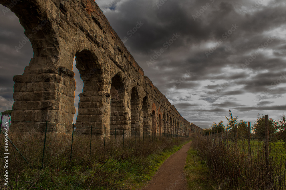 Ancient roman aqueduct outside of Rome, Italy.
