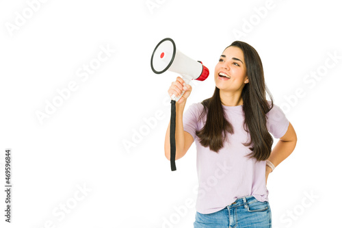 Young woman screaming with a megaphone