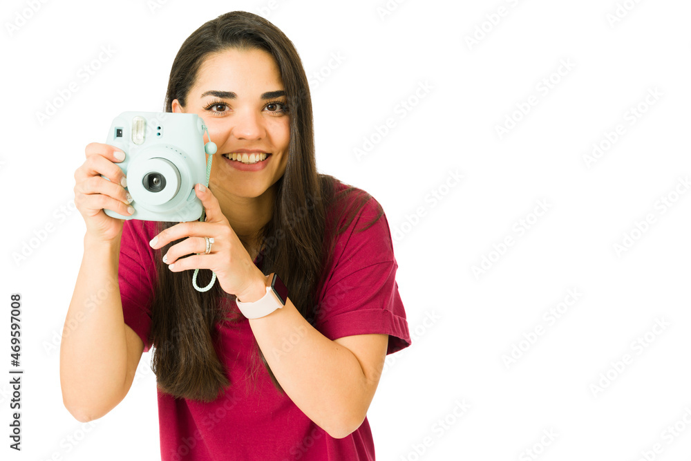 Portrait of a woman using a camera Portrait of a woman using a camera