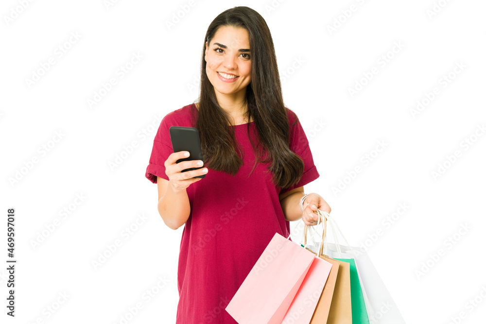 Happy woman carrying shopping bags Happy woman carrying shopping bags