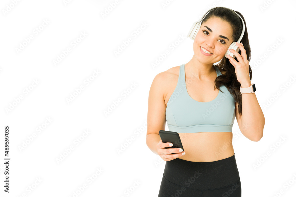 Active woman using wireless headphones