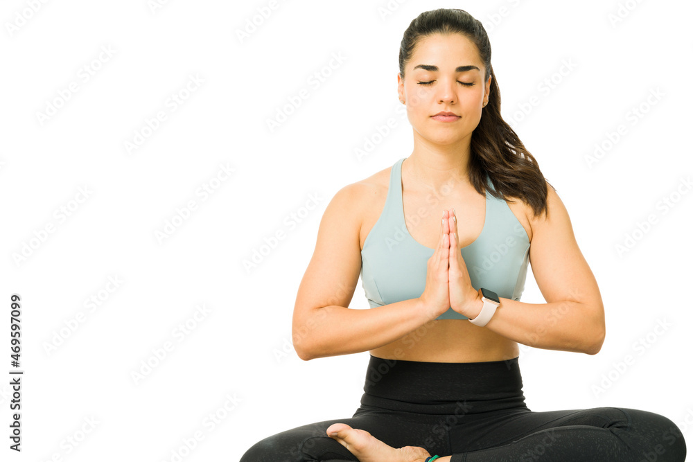 Sporty woman relaxing with yoga