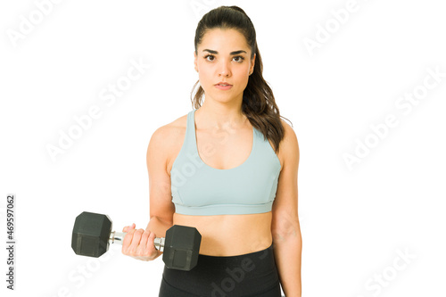 Beautiful woman exercising with weights