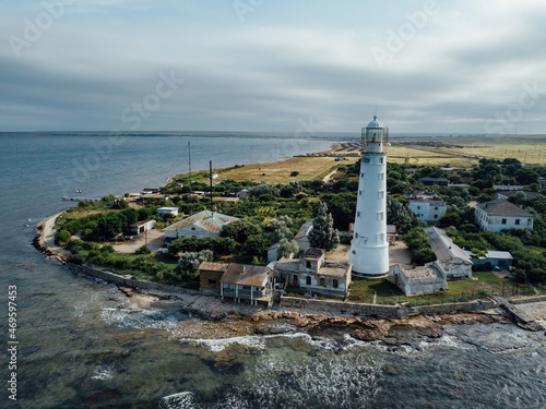 Lighthouse on the sea coast, aerial drone view